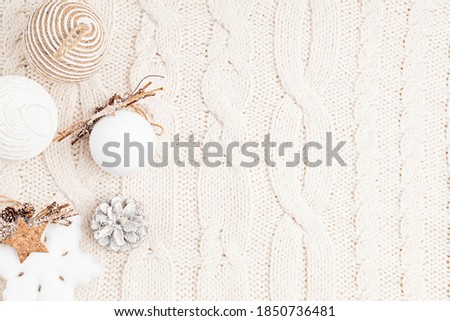 Assortment of Scandinavian style, cozy eco friendly, Handmade Christmas ornaments and gifts on light background, flat lay, top view with copy space