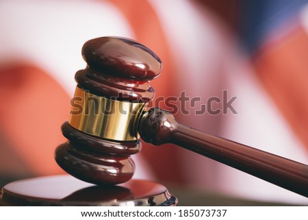 Gavel and american flag, symbol for jurisdiction , selective focus Royalty-Free Stock Photo #185073737