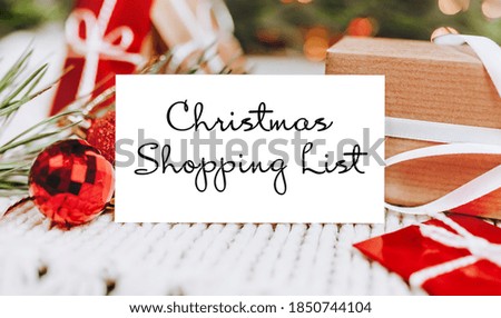 Merry christmas and merry new year concept with gift boxes and greeting card with text Christmas Shopping List