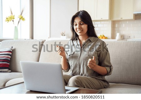 Young adult indian woman distance teacher, tutor, job applicant talking by video conference call using laptop computer work from home office. Virtual chat meeting, web counseling, remote job interview Royalty-Free Stock Photo #1850820511