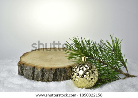 Minimal. Christmas background with a podium for presentation of the product. Natural wooden pedestal. Happy New year and merry Christmas.