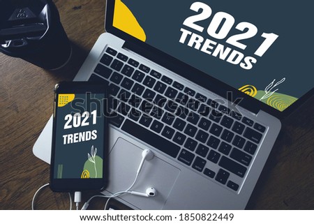 2021 year trends in smartphone and laptop screen. Royalty-Free Stock Photo #1850822449