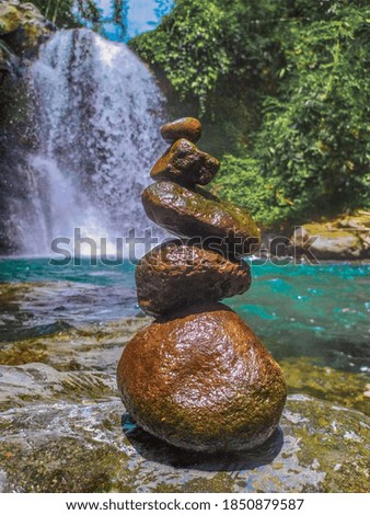 Stacked stones on the bank of a river