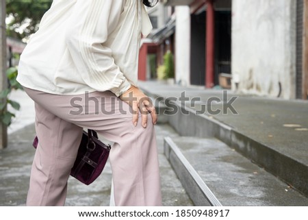 Old asian woman having knee joint pain or knee injury problem, concept of accessibility or a11y Royalty-Free Stock Photo #1850948917