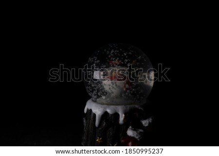 Snowball in action at black background