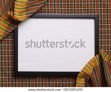 Top view of blank photo frame on Thai fabric texture