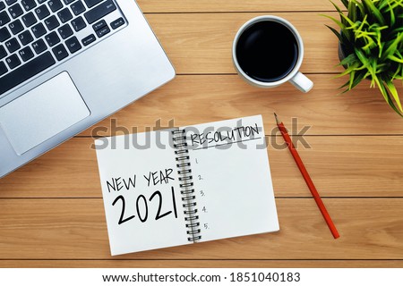 2021 Happy New Year Resolution Goal List - Business office desk with notebook written in handwriting about plan listing of new year goals and resolutions setting. Change and determination concept. Royalty-Free Stock Photo #1851040183