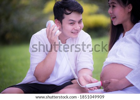  beautiful pregnant woman husband examining a pregnant woman
