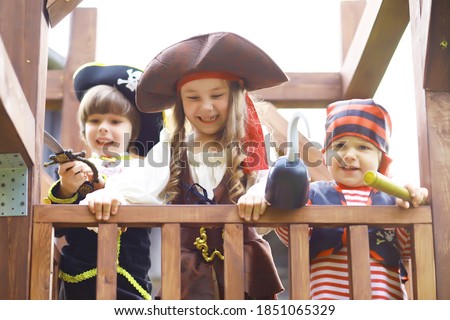 Children's party in pirate style. Children in pirate costumes are playing on Halloween.