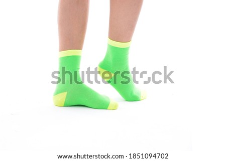 Female legs with colorsocks fashion on white background

