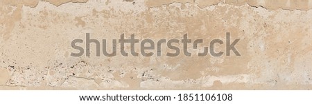 Fragment of the old concrete wall partly plastered, panoramic view close-up. Texture, background

