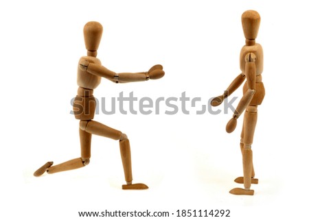 Marriage proposal concept with wooden mannequins on white background