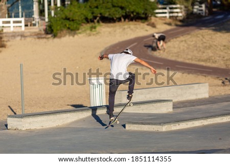 Young man skateboarding in skate park ramp