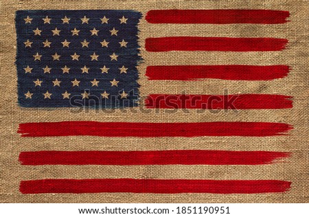 Hand-drawn American flag on a burlap background. American banner imprint.
