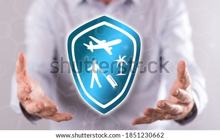 Travel insurance concept above the hands of a man in background