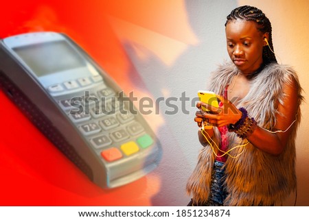 Woman next to a payment terminal. Concept - payment using NFC. Girl uses pay pass to pay. Concept-student pays via phone. Payment terminal as a symbol of purchase. African American on red background