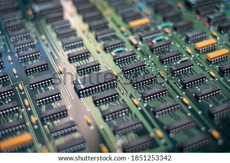 Closeup Electronic circuit board ( PCB )components detail and An integrated circuit (ic)  Royalty-Free Stock Photo #1851253342