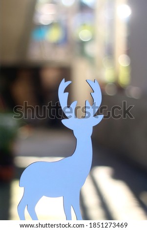Deer figurine, minimal Christmas decoration. Selective focus.