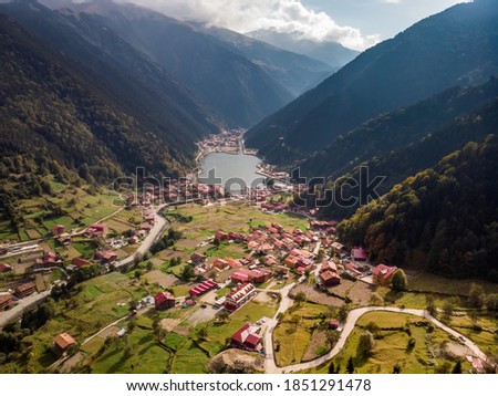 Uzungol (Long Lake) among the most beautiful tourist places in Turkey. The mountain valley with a trout lake and a small village in Trabzon, Turkey. Popular destination for locals and tourists. Royalty-Free Stock Photo #1851291478