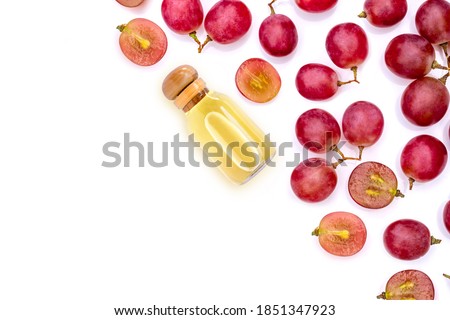 Grapes seed oil isolated on white background. Top view. Flat lay. Royalty-Free Stock Photo #1851347923