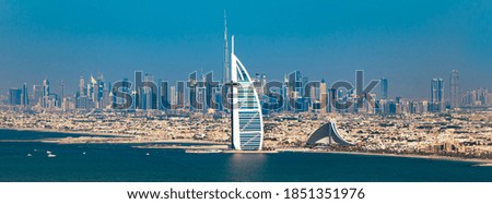Dubai - Amazing city center skyline and famous Jumeirah beach and Palm Jumeirah in the morning, United Arab Emirates