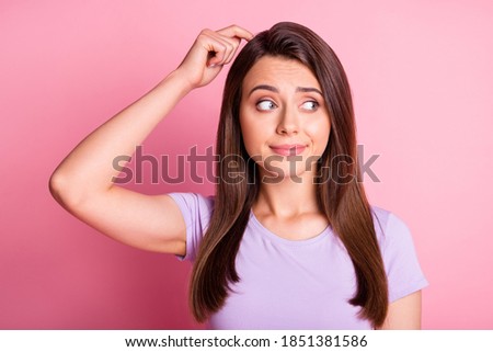 Photo portrait of confused woman scratching head with finger isolated on pastel pink colored background Royalty-Free Stock Photo #1851381586