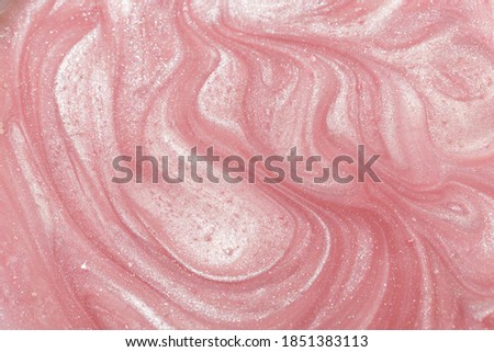 Pink liquid shimmering cosmetic product studio shot. Royalty-Free Stock Photo #1851383113