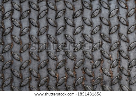 Textured background, non-slip steel plate, diamond pattern, gray black, close-up photo used for wallpaper design, beautiful abstract pattern, Checker Plate.