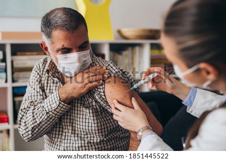 home care doctor service, virus corona 19 vaccination Royalty-Free Stock Photo #1851445522