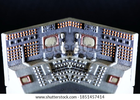 Miniature model of vintage electrical control board on the dark background scene represend technology concept related idea.