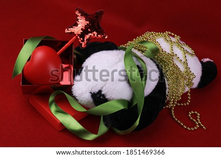 Panda Plush Doll with Christmas Ornaments for Decoration, Red Star, Green ribbon, Gold Chian, Red Heart, Red background