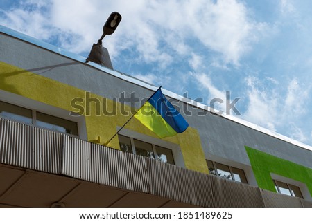 Ukrainian flag above the school entrance