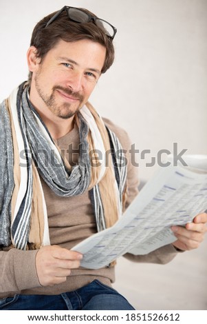 business man reading a newspaper