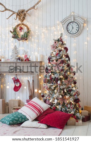 Christmas tree in classic red and white color. Interior. 