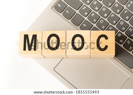 Word mooc. Wooden small cubes with letters isolated on white background with copy space available. Business Concept image.