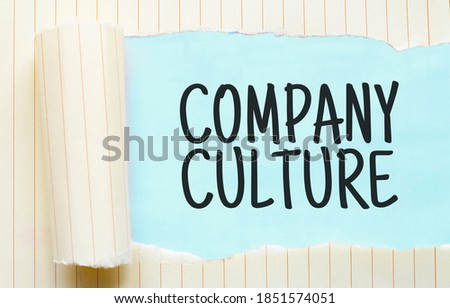 The text COMPANY CULTURE appearing behind torn white paper