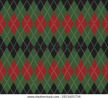 Knitted argyle Christmas and new year pattern. Wool knitinng. Scottish plaid in red, black and green rhombuses. Traditional  background of diamonds. Seamless fabric texture. Vector illustration