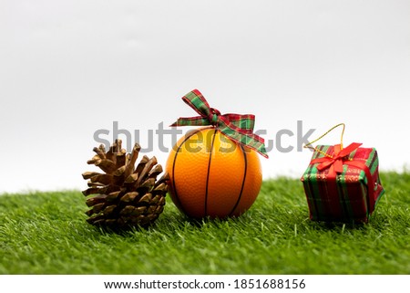 Basketball Christmas with Christmas ornament on green grass 