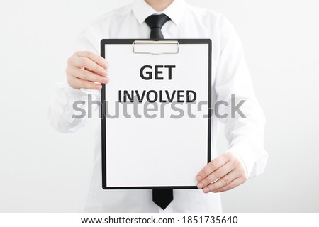 businessman holds a folder with the inscription Get Involved. Business, technology, internet and networking concept