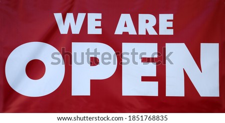 WE ARE OPEN. Red WE ARE OPEN vinyl sign. Open for business sign. 