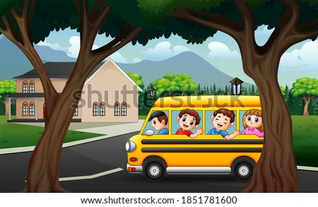 Happy kids in yellow bus through the highway