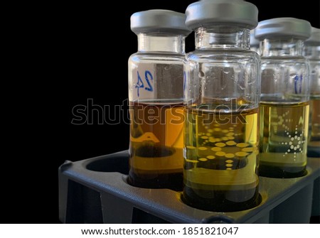 Small bottles of transformer oil in the test Lab for Dissolved Gas Analysis test. no focus