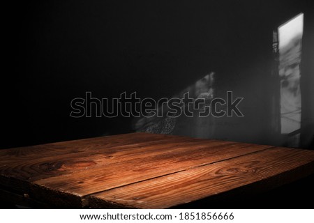 black background wall, with empty work table