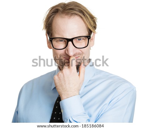 Closeup portrait, nerd, smart simple young man, student with black glasses, thinking, finger on mouth, looking at you, deciding, isolated white background. Human emotions, facial expressions, feelings