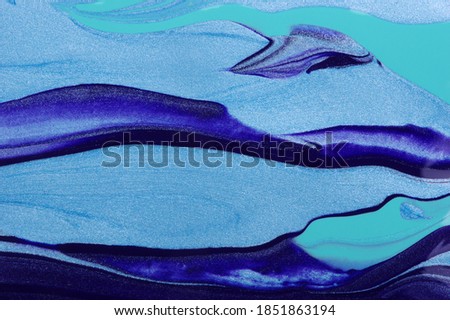 Close up photo of blue paint waves . Liquid art marble texture.   