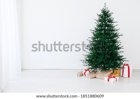 Christmas tree with decorations and gifts new holiday year