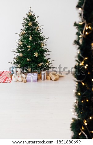Christmas tree with decorations and gifts New Year holiday