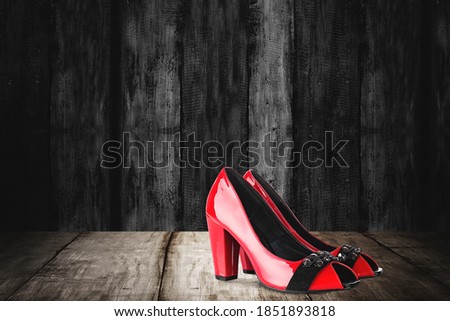 High heels with a wooden background. Black Friday concept