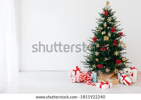 Christmas tree pine with decorations and gifts new year December