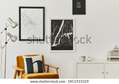 Retro and minimalist composition of living room interior with design armchair, mock up poster map, lamp, decoration, white wall and personal accessories. Template. Modern home decor.